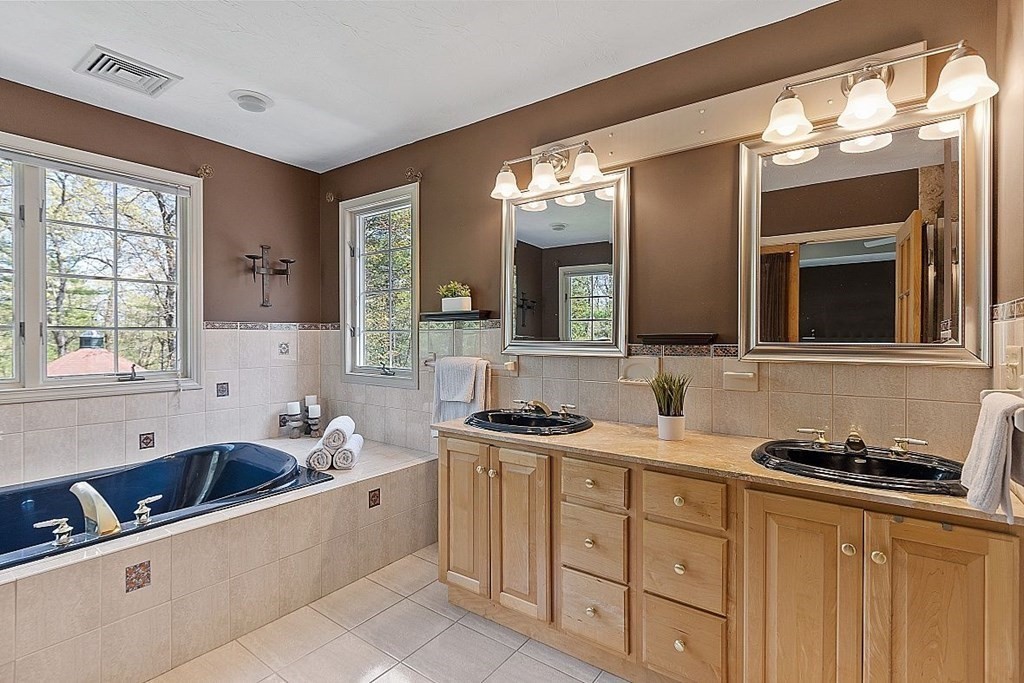 793 Reservoir Road Lunenburg, MA 01462 - Photo 21 of 39 a bathroom with a sink and a bathtub
