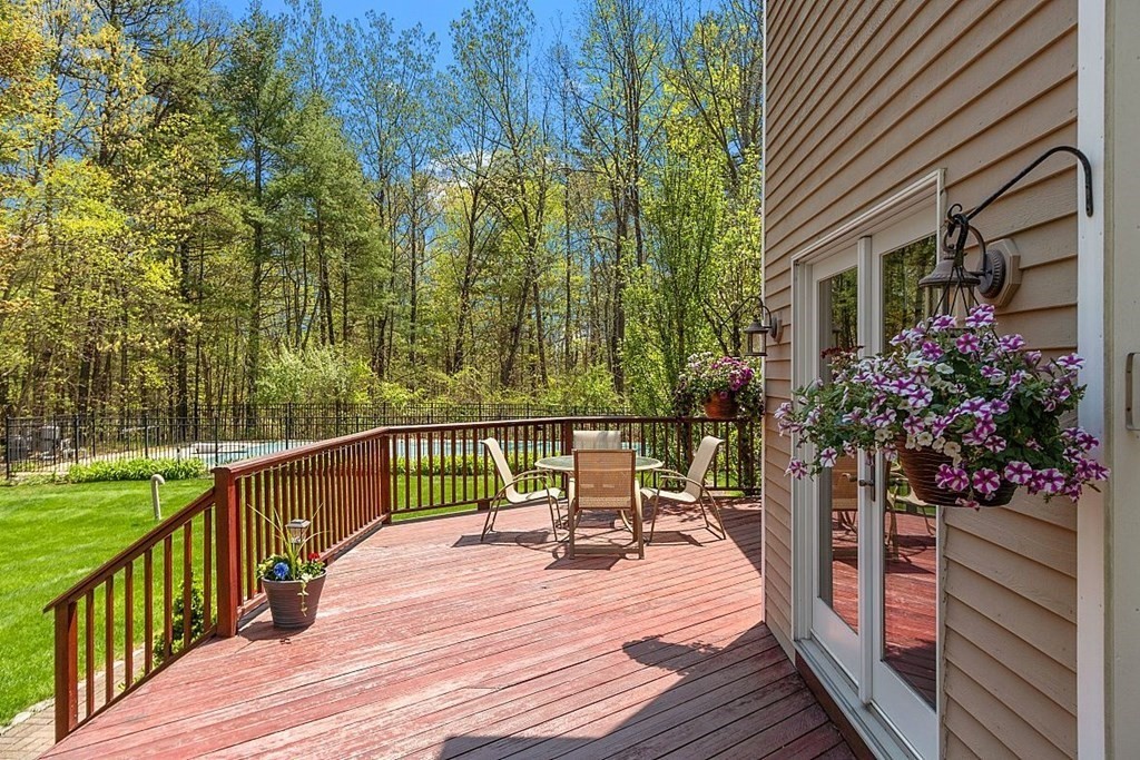 793 Reservoir Road Lunenburg, MA 01462 - Photo 33 of 39 a view of a chairs and table on the wooden deck