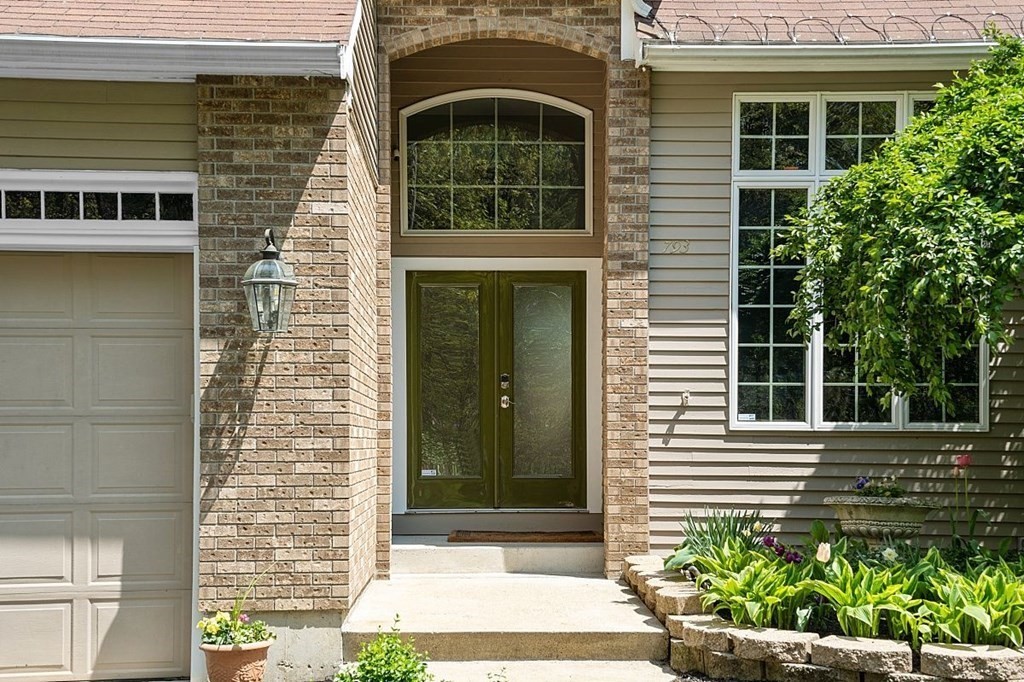 793 Reservoir Road Lunenburg, MA 01462 - Photo 39 of 39 a view of a brick house with plants