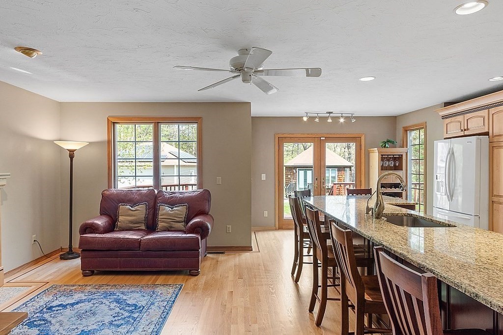 793 Reservoir Road Lunenburg, MA 01462 - Photo 10 of 39 a living room with furniture and a window