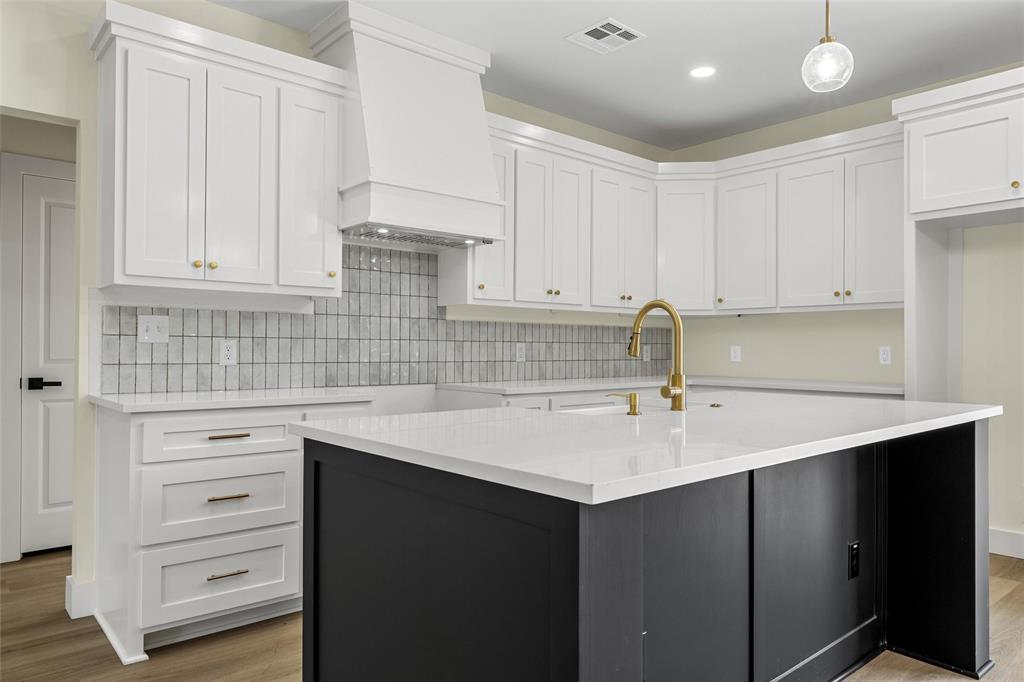 3320 North 27th Street Waco, TX 76708 - Photo 10 of 38 a kitchen with a sink dishwasher and cabinets