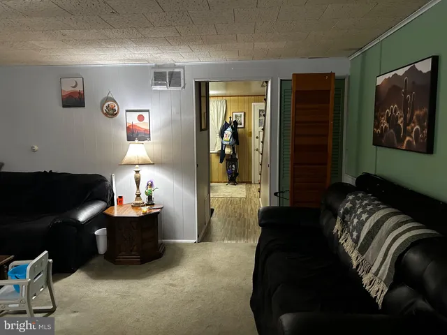a bedroom with furniture and a lamp