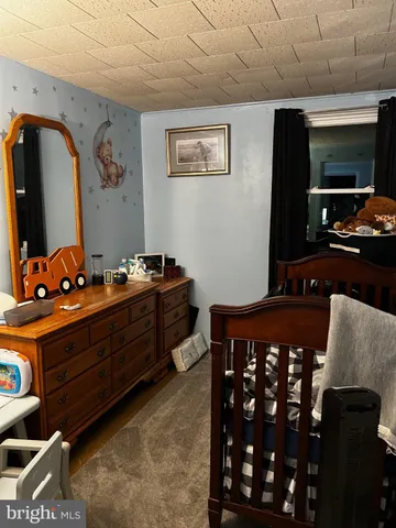 a room with furniture and mirror