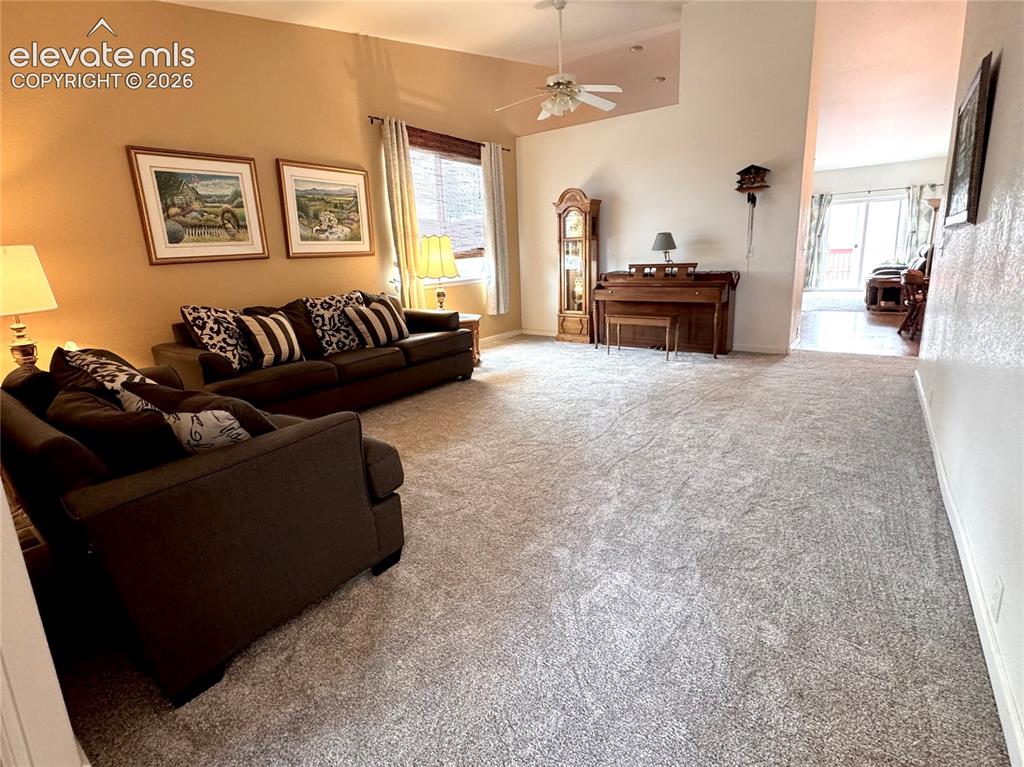 9362 St.George Road Peyton, CO 80831 - Photo 2 of 32 a living room with furniture and a large window