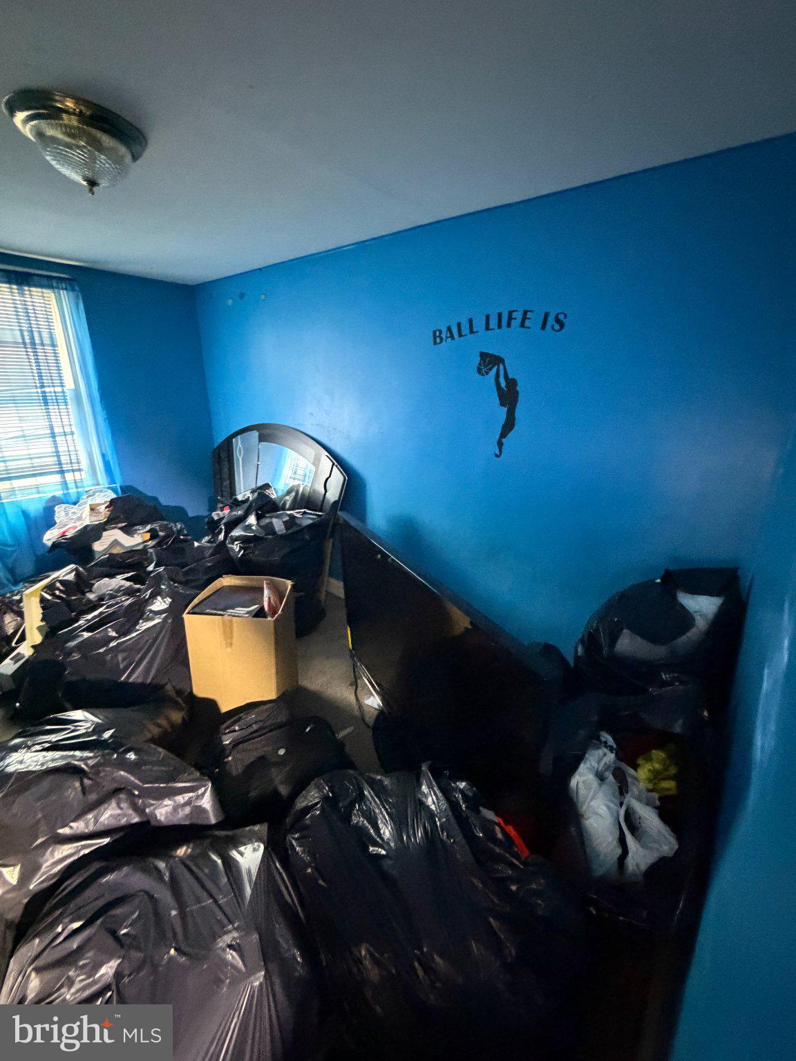 244 Cambridge Road Clifton Heights, PA 19018 - Photo 25 of 33 Cluttered space with vibrant blue walls.