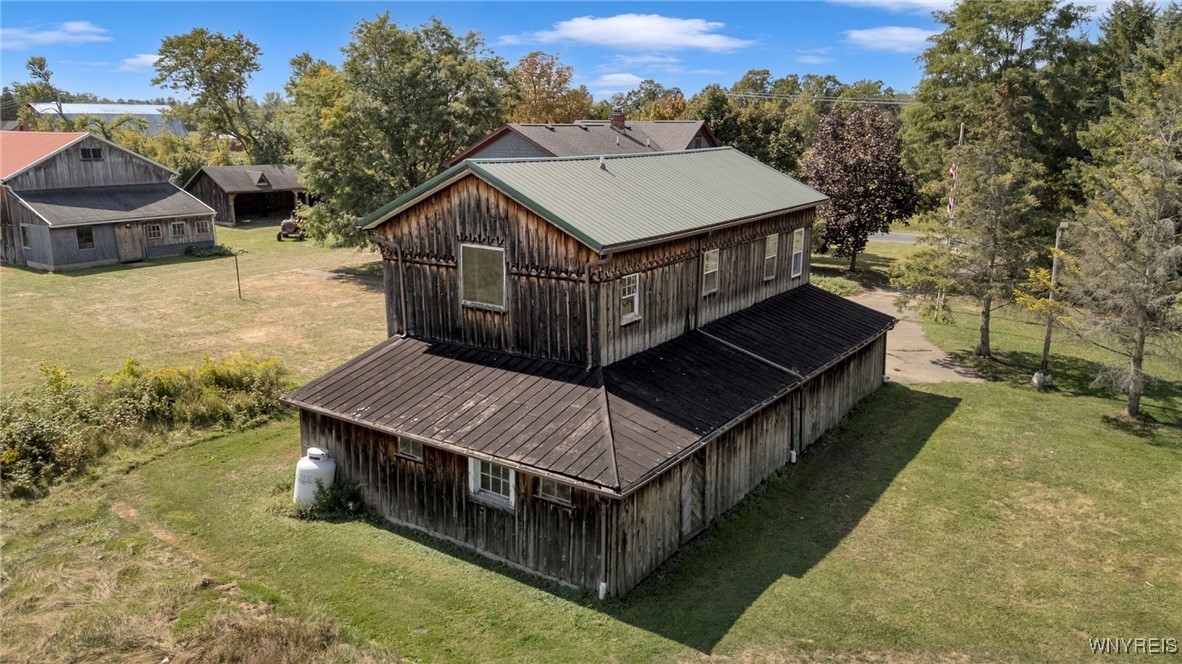 7745 Westphalinger Road Clarence, NY 14051 - Photo 41 of 50 rear of detached garage with - storage on perimete