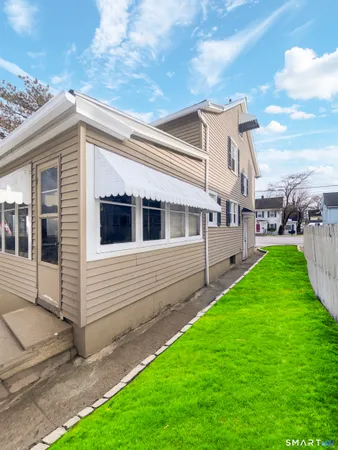 a view of a house with a yard