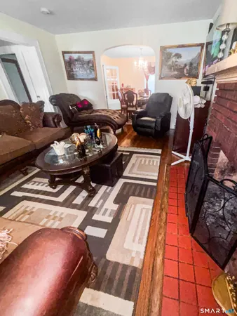 a living room with furniture and a rug