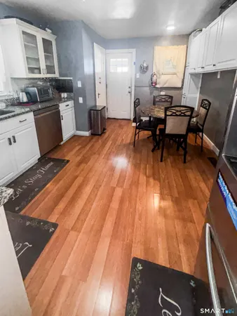 a kitchen with a sink and a stove top oven