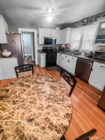 a kitchen with a stove and a refrigerator