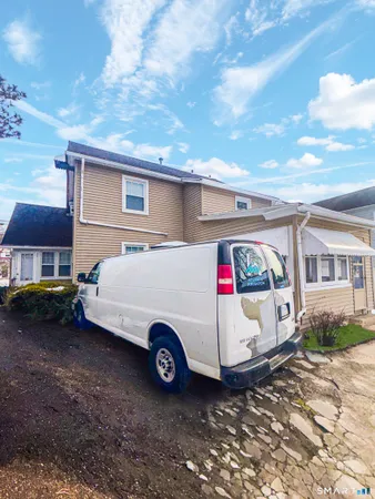 a car parked in front of a house