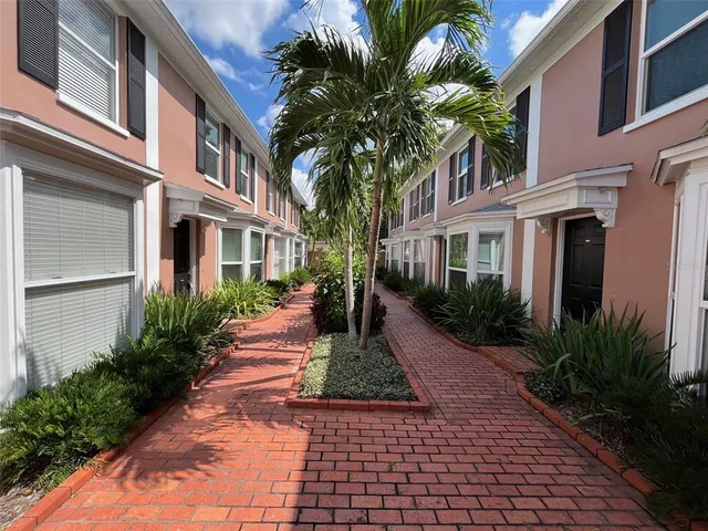 a view of a pathway both side of house