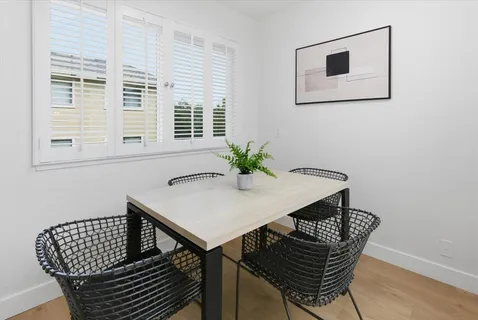 a view of a workspace with furniture