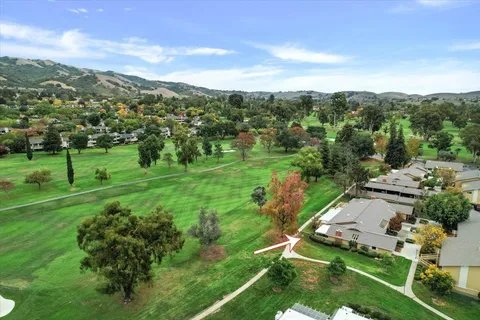 a view of a garden with mountains