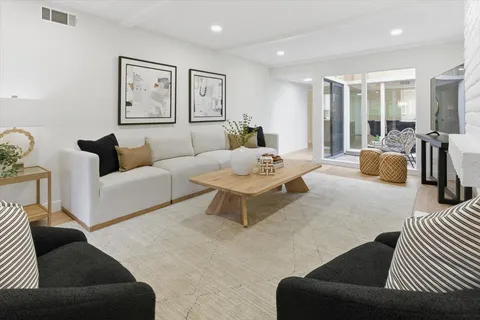 a living room with furniture and a table
