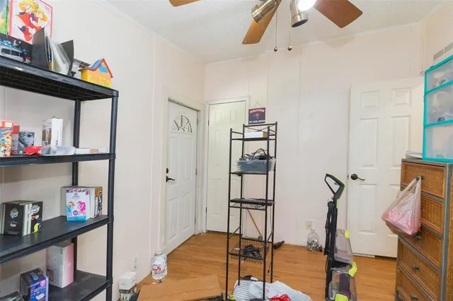 a bedroom with furniture and a window