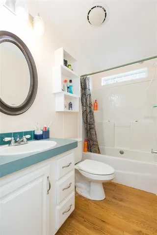 a view of a patio with table and chairs with wooden fence