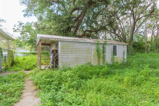 a view of a living room and kitchen