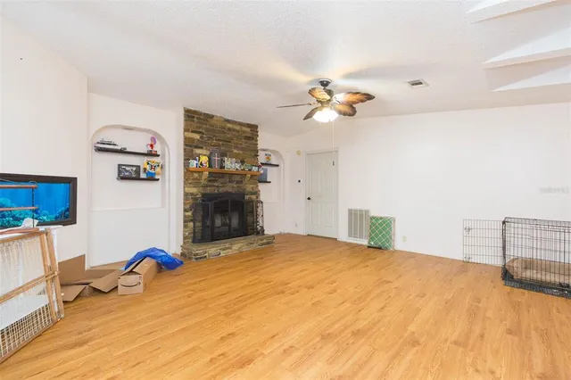 a bedroom with a bed dresser and a chandelier