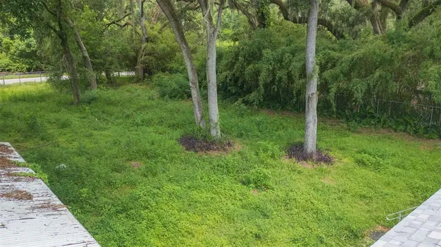 a aerial view of a house with a yard