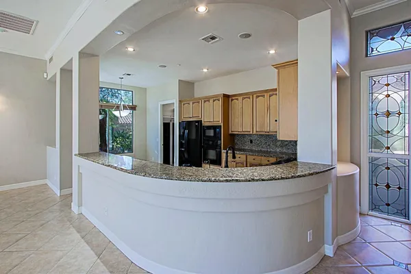a view of living room with granite countertop furniture and fireplace