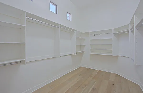 a view of an empty walk in closet