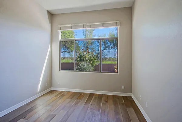 a view of room with window and hardwood floor