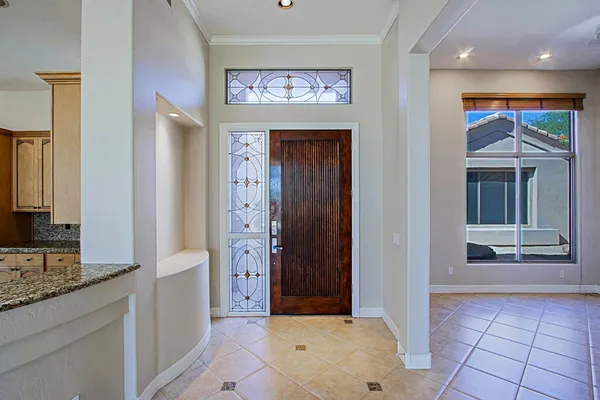 a view of hallway with a large mirror and a sink