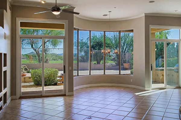 a view of a room with a large window and an outdoor space