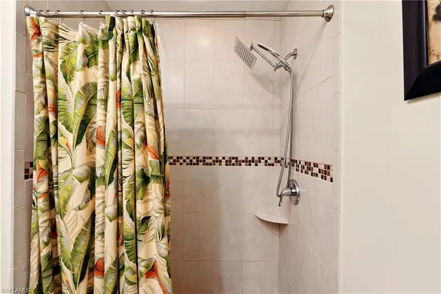 a bathroom with a shower and a shower curtain