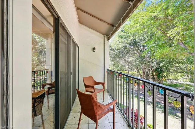 a view of a balcony with furniture