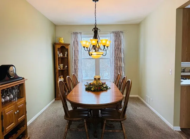 a dining room with furniture and window