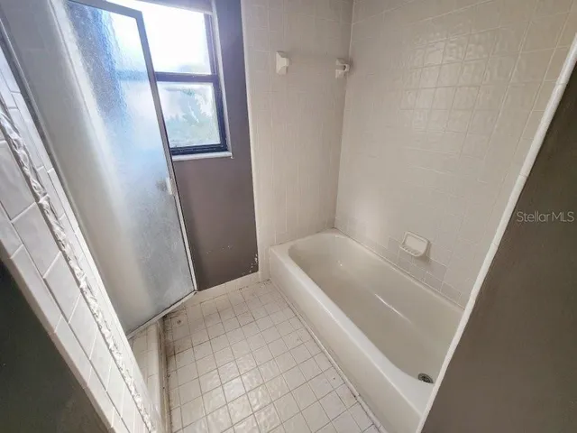 a bathroom with sink and window