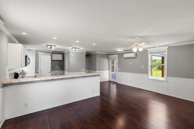a large kitchen with lots of counter space and a sink