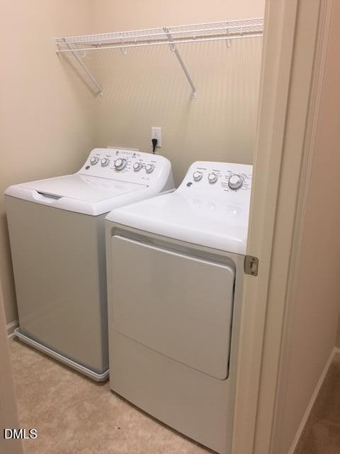 134 Zante Currant Road, Unit 134 Durham, NC 27703 - Photo 7 of 14 a utility room with dryer and washer