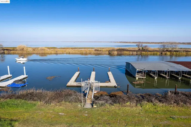 an aerial view of a house with outdoor space