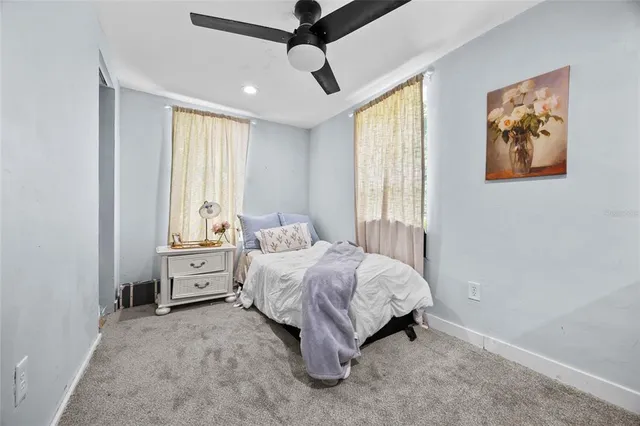 a bed room with a bed and a window