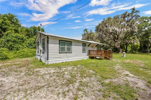 a view of a house with a back yard