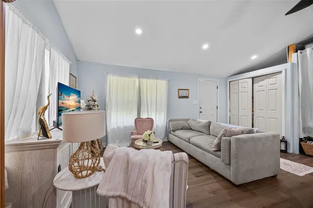 a living room with furniture and a window