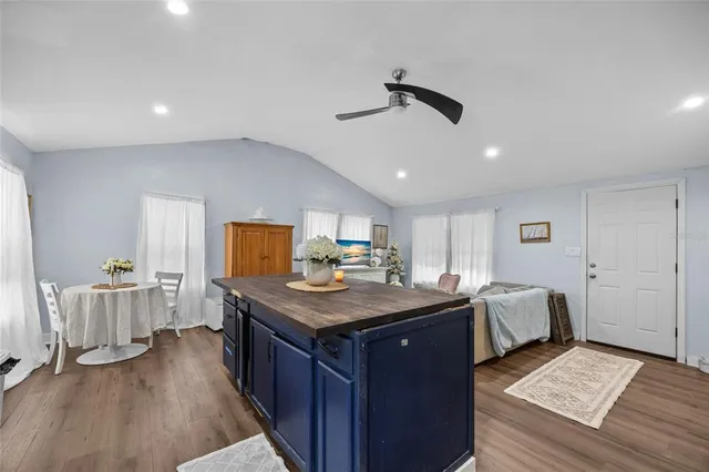 a view of a kitchen counter space with wooden floor