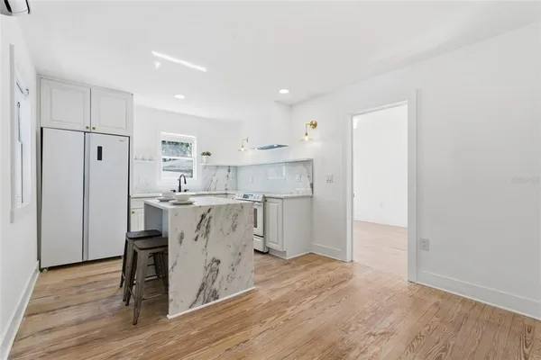 a view of kitchen with wooden floor