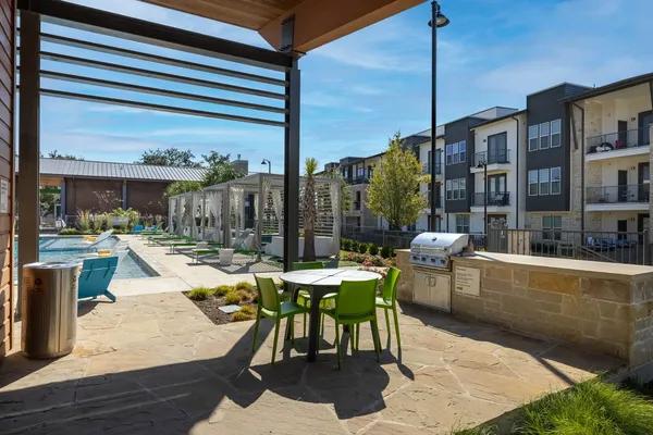 a outdoor space with lots of chairs and wooden floor