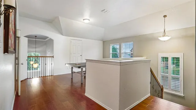 a view of kitchen with furniture and wooden floor