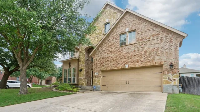 front view of a house with a garden