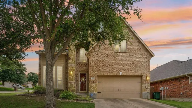 an aerial view of a house with outdoor space and street view