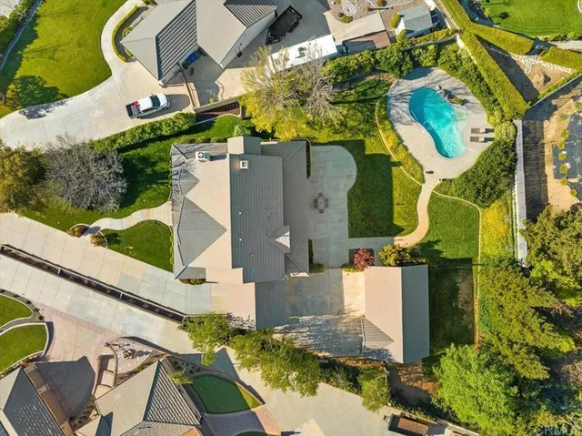 an aerial view of a house with swimming pool
