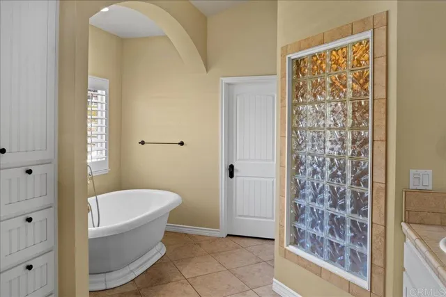 a bathroom with a bathtub and shower