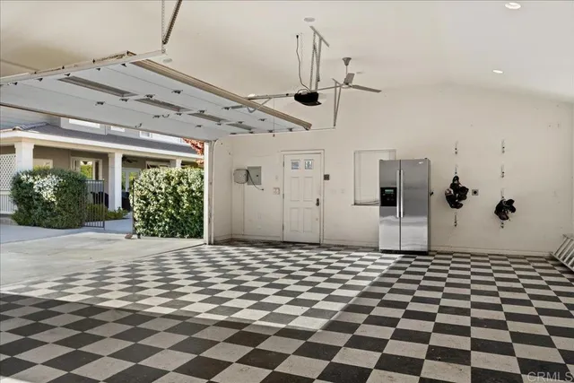 a bathroom with a black white checkered floor