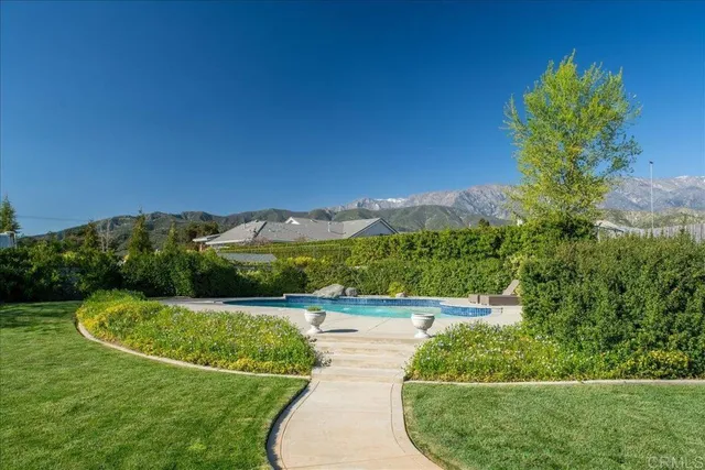a view of a garden with a building in the background
