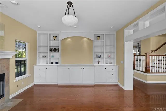 a view of a kitchen with cabinet and mirror
